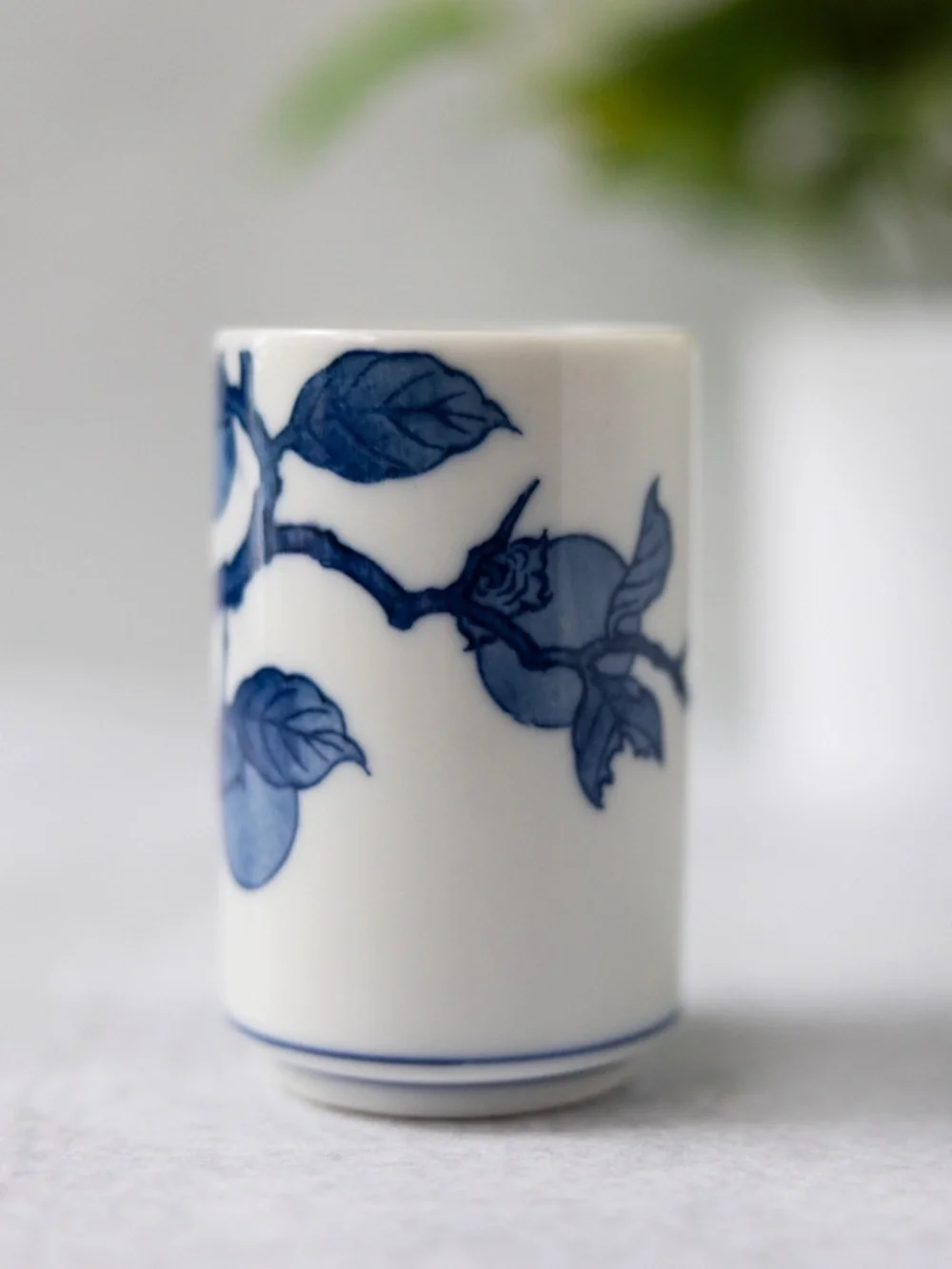 Vintage Otagiri blue white ceramic persimmon tea cup or small vase 3 3/8